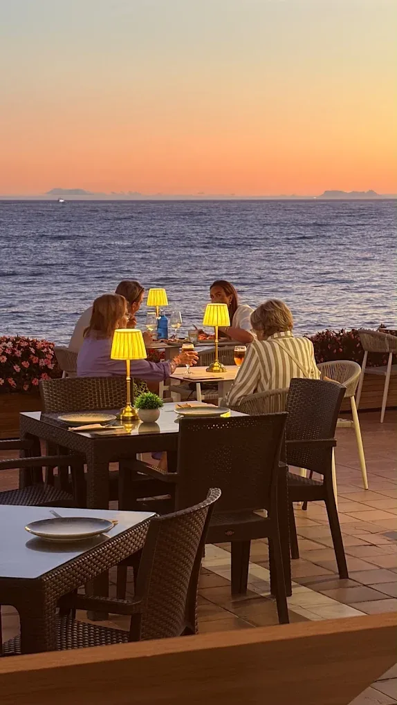 Guests on the terrace at sunset