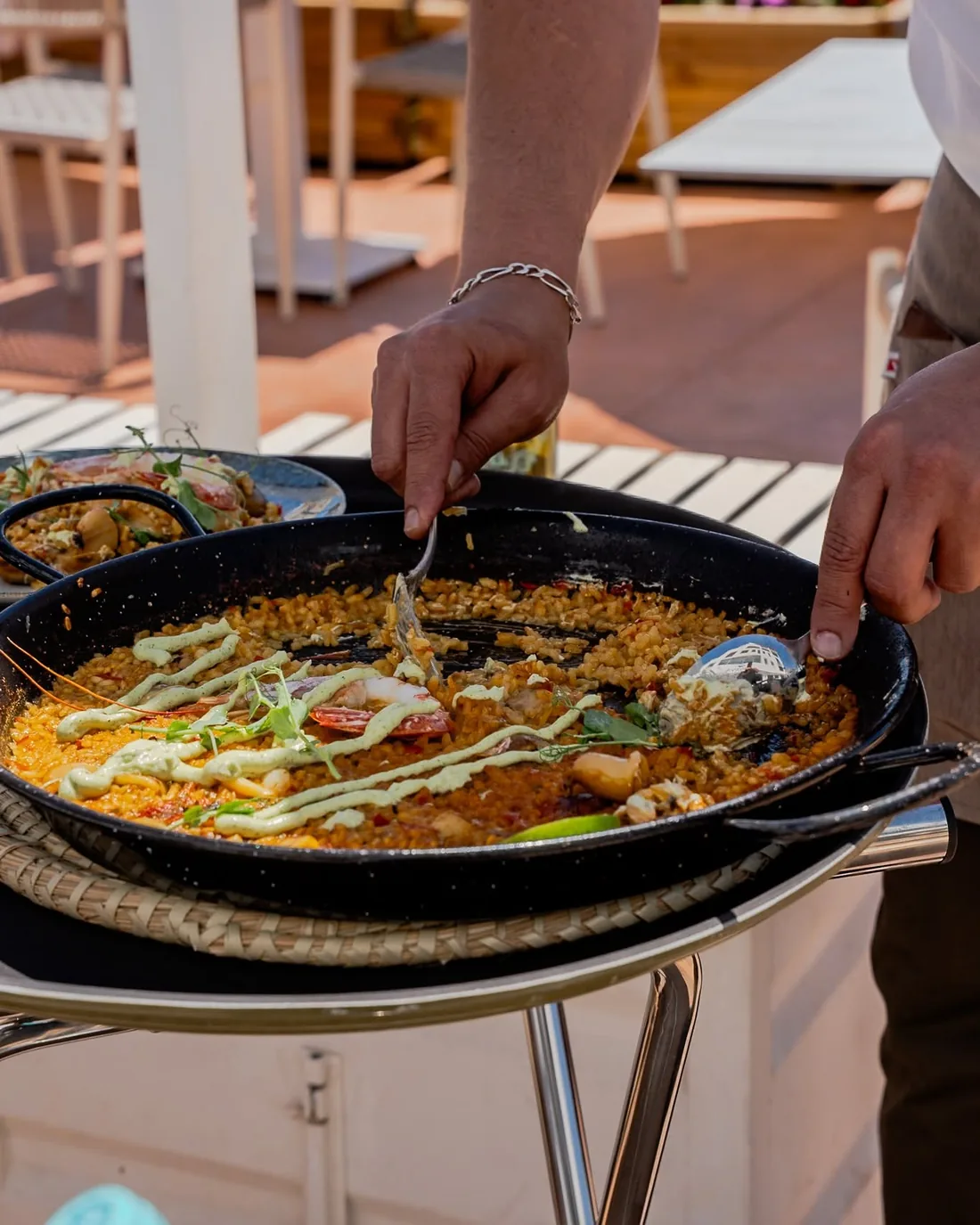 Serving paella from the pan