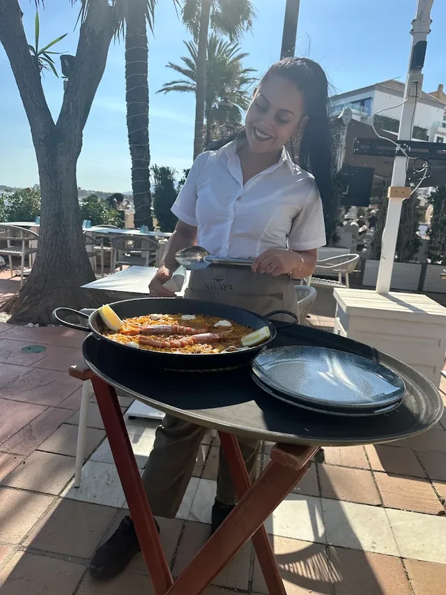 Carrying paella out to the terrace